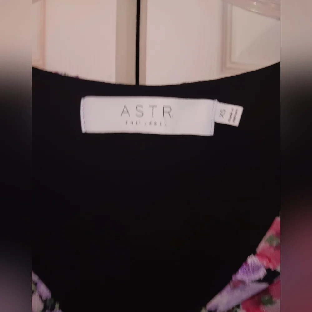 Astr the Label Black Lilac Floral Peplum Wrap Blouse.  Size XS.